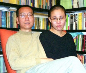 (FILES) Photo taken October 22, 2002 shows Chinese dissident Liu Xiaobo (L) and his wife Liu Xia posing for a photograph in Beijing. Prominent Chinese dissident Liu Xiaobo, who signed a charter calling for democratic reforms, is being held in a form of detention that typically precedes a trial, human rights activists said January 2, 2009. Liu, a leading dissident writer, was taken away by police on December 8, and his location has remained unknown as prominent international authors and academics have called for his release. CHINA OUT GETTY OUT AFP PHOTO
