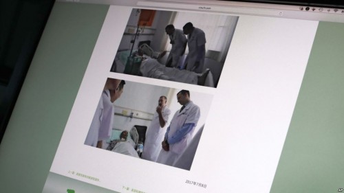 沈阳中国医科大学附属第一医院在官方网站上发布美国安德森癌症中心的赫尔曼医生和德国海德堡大学的布赫莱尔医生（右）在该医院与诺贝尔和平奖得主刘晓波见面的照片。